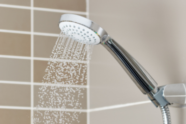 shower head, showcasing the hot water services Vision Plumbing Heating Cooling provides in Kelowna, BC and surrounding Okanagan communities.