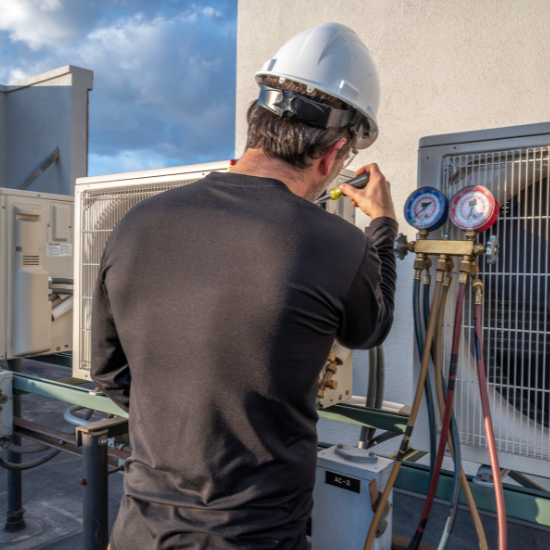 HVAC mechanic servicing a mini split AC