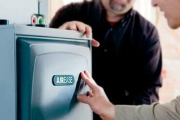 People touching an AirEase HVAC system